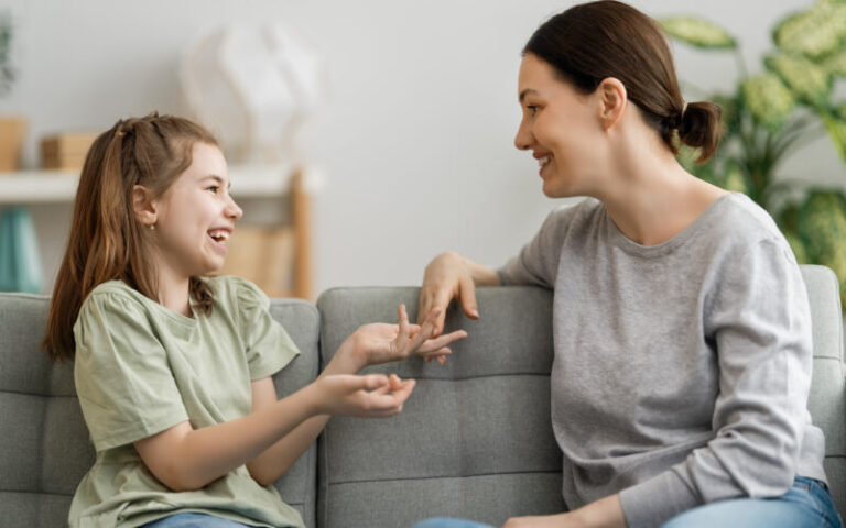 Mother and daughter conversing in joy.