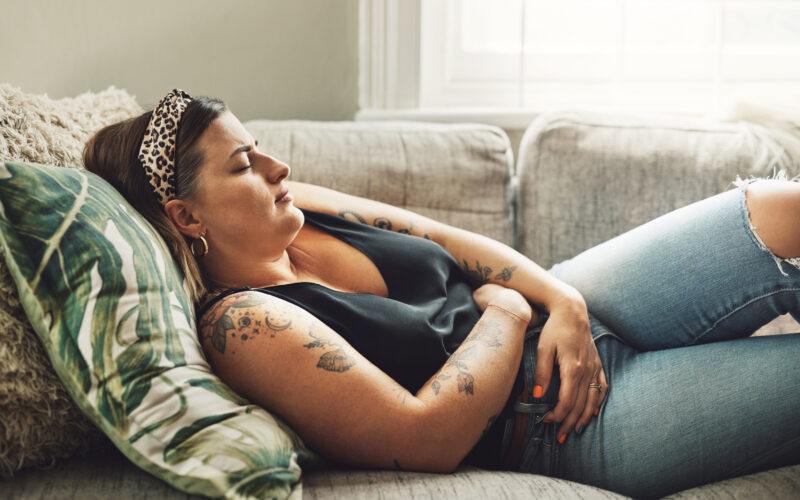 Woman experiencing menstrual cramps.